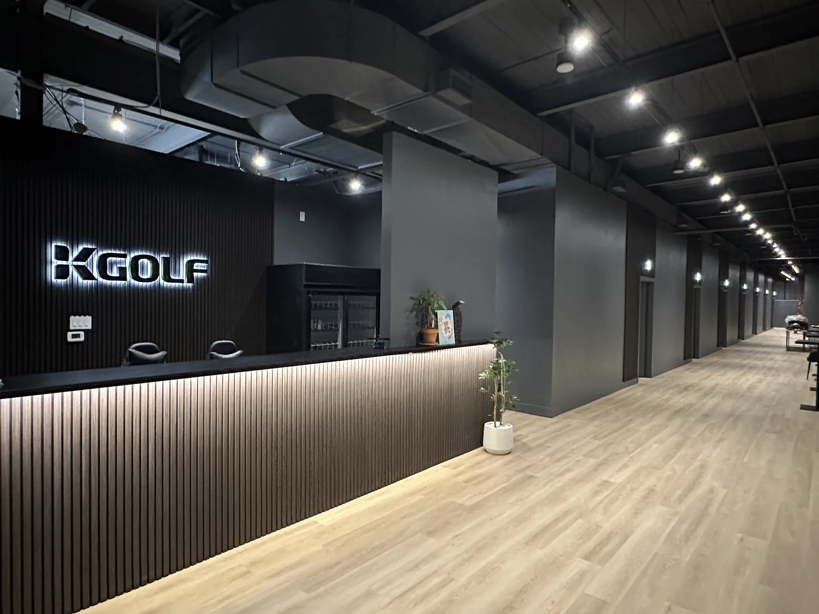 Reception desk and KStadium wall branding